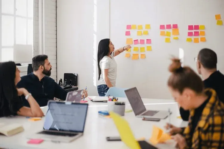 A product manager speaking with her team.