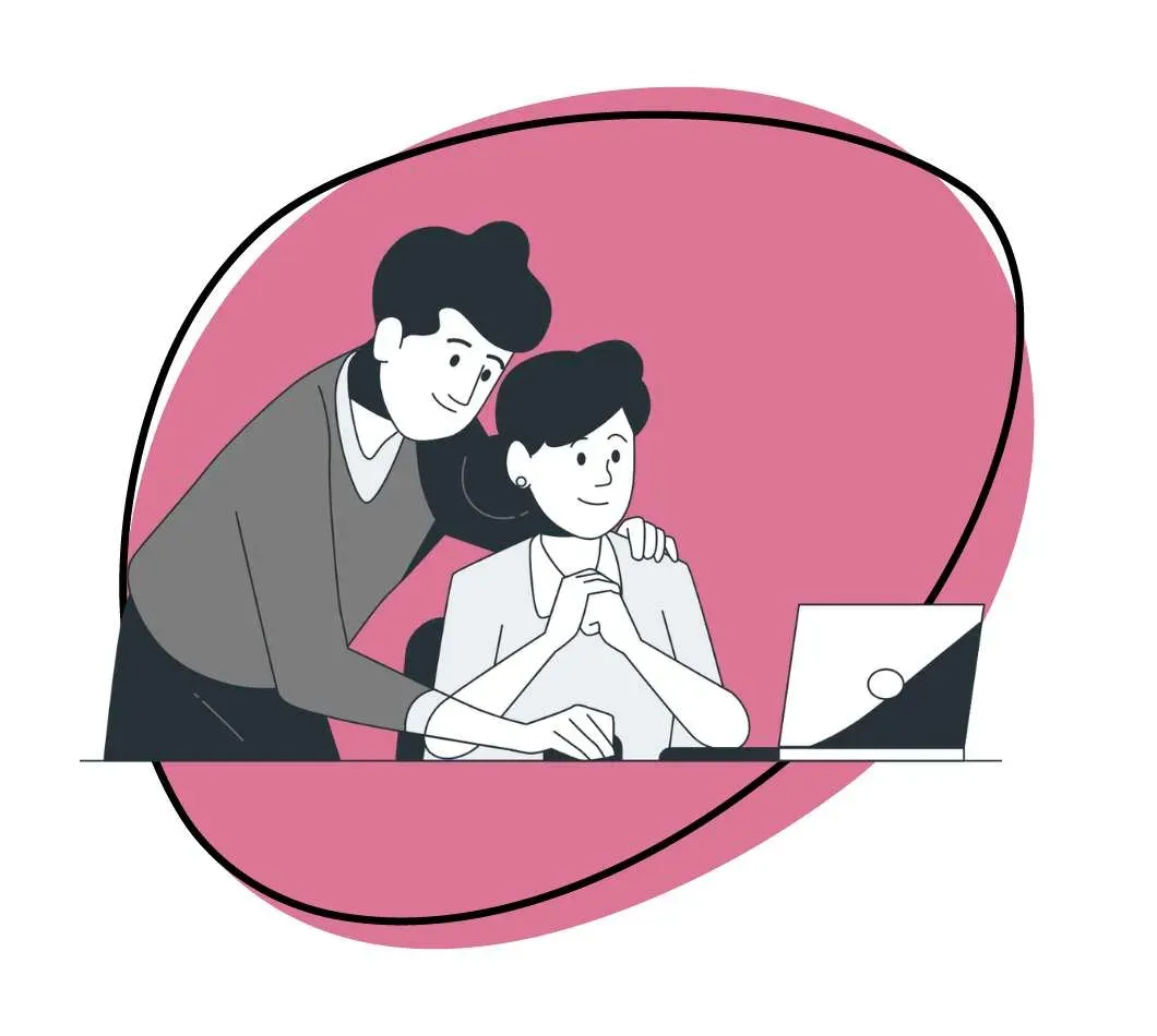Two people review a video together on a laptop